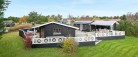 Flot moderniseret sommerhus med hyggelige udearealer