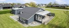 Enestående sommerhus med havudsigt på lejet grund